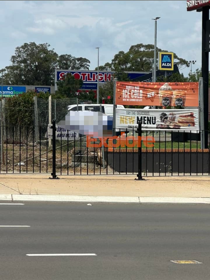 Police Place Sheet over vehicle at McDonald's Mt Druitt as passenger found dead in vehicle